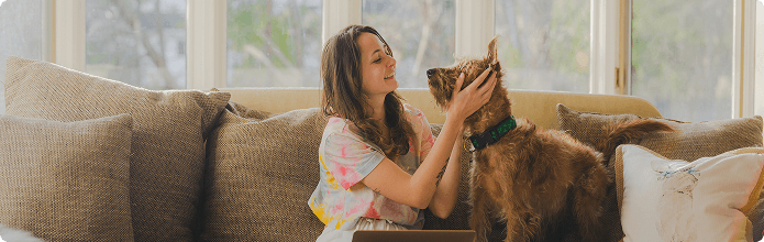 Person bonding with their emotional support dog