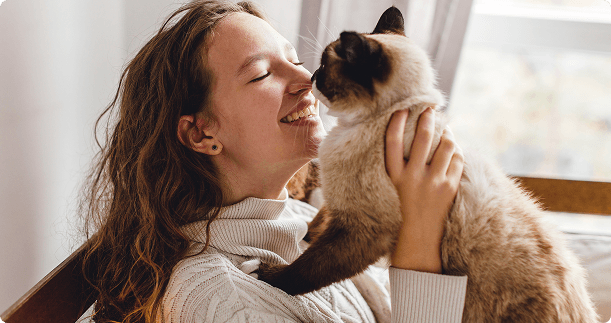 Pet owner bonding with their emotional support cat