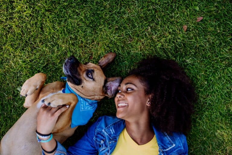 Emotional support animal Washington DC. A girl and her emotional support dog lying on the grass