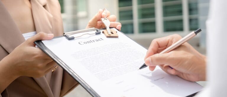 Emotional support animal and fair housing act. ESA and landlords. A person signing a contract on a clipboard