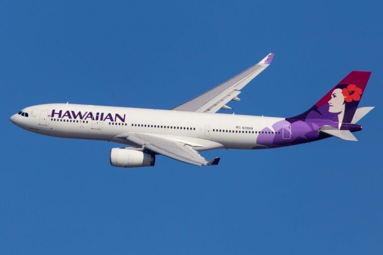 ESA and Hawaiian airline. An Hawaiian airline aircraft flying in the sky