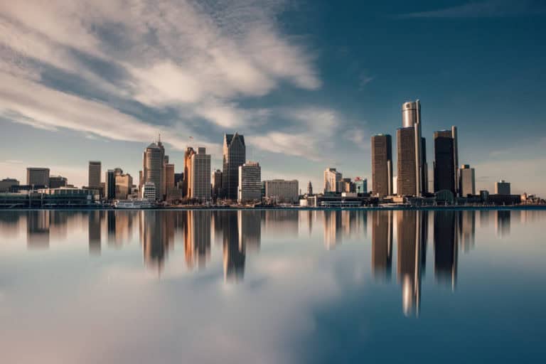 Skyline of Michigan buildings against a blue sky
